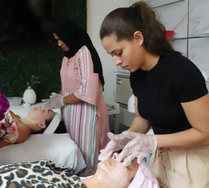 esthetics students servicing clients